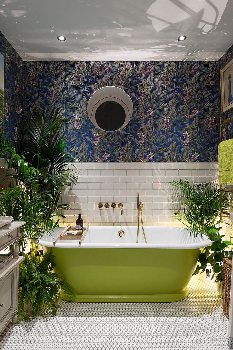 Wallpaper and plants create a jungle-inspired environment inside the eclectic bathroom [Design: Alexander Owen Architecture]