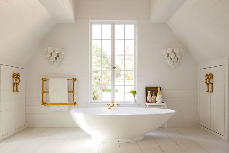 White bathroom with brass details