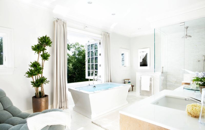 White bathroom with luxe seating