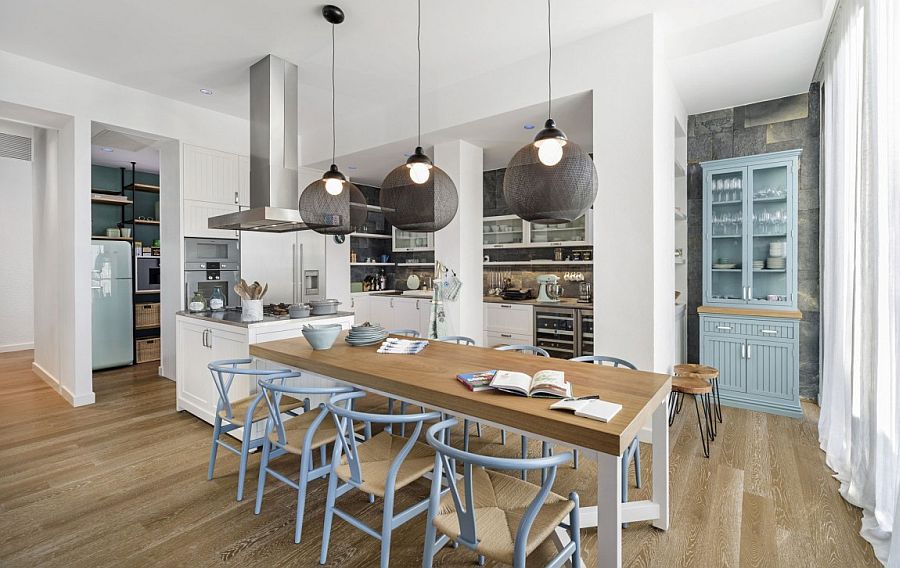 Wishbone chairs at the dining table add timeless charm to the dreamy interior