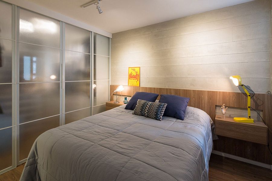 Wooden accent wall inside the contemporary bedroom