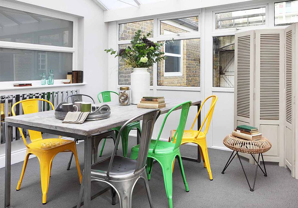 A blend of colorful chairs is a trendy choice in the dining room [Design: Oliver Burns]