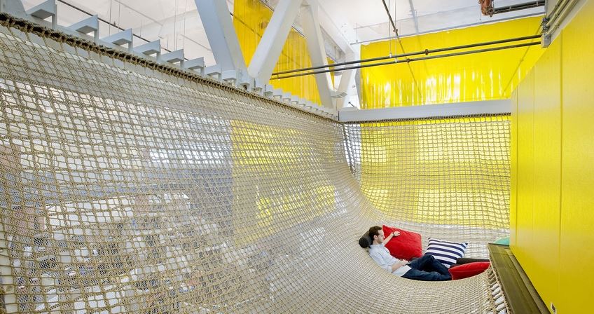 Man sitting in net at Google Pittsburgh office