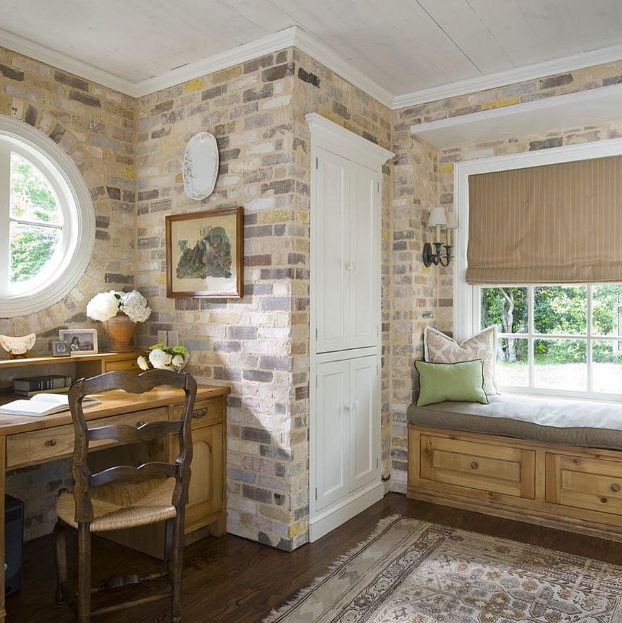 Antique brick walls steal the show in this home office mudroom combo