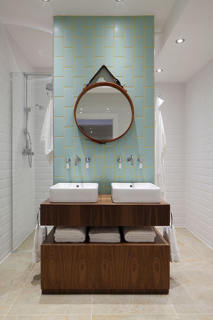 Aqua and yellow add subtle color to the stylish bathroom [Design: Oliver Burns]