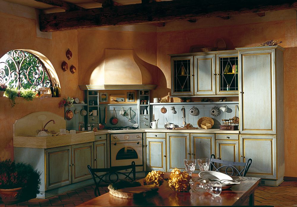 Beautiful earthen hues and textured walls shape a stunning Mediterranean kitchen isnpired by design style from Southern France