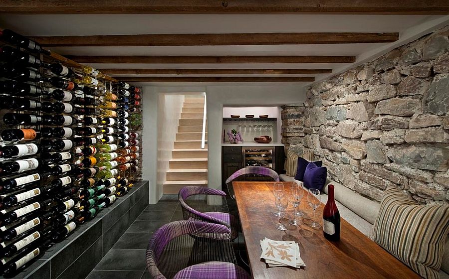 Chairs add color and informal charm to the wine tasting room with stone walls