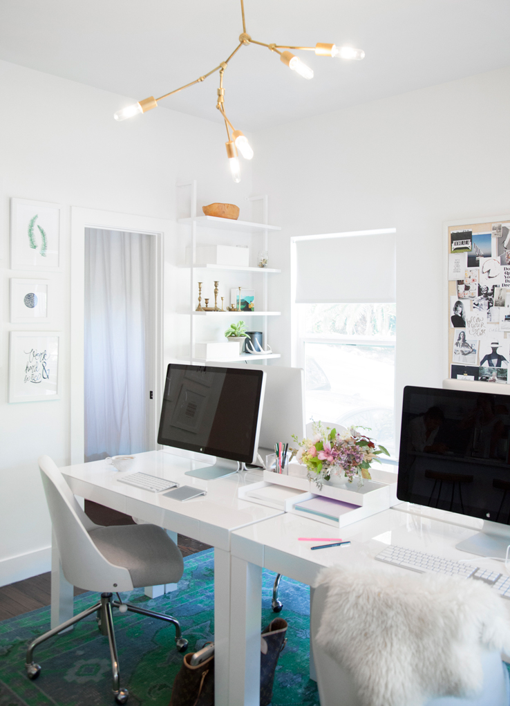 Chandelier lighting in the studio of Camille Styles