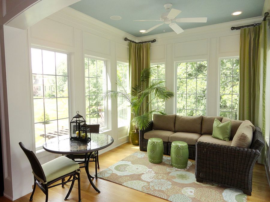 Chinese stools, drapes and house plant add greenery to the cool sunroom with Asian style