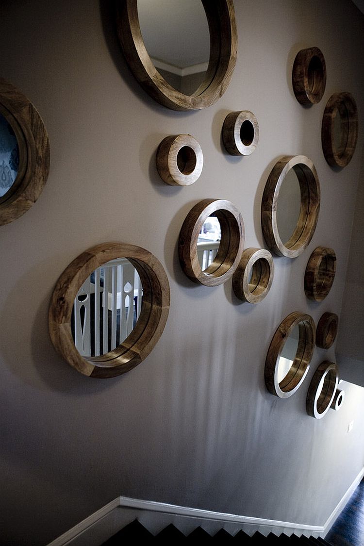 Circular mirror collection for the stairway wall [Design: Amoroso Design]