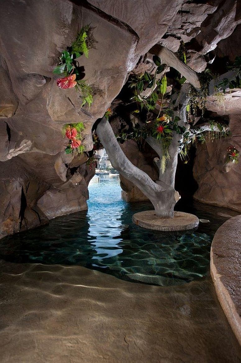 Concealed cave-styled next to the pool is the perfect way to complete your backyard paradise