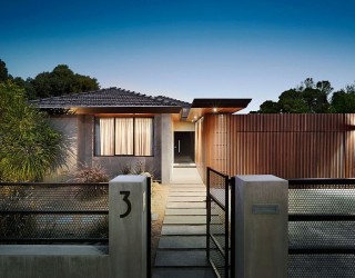 An Entrance to Behold: 1970s Home Acquires a Modern Minimal Sheen