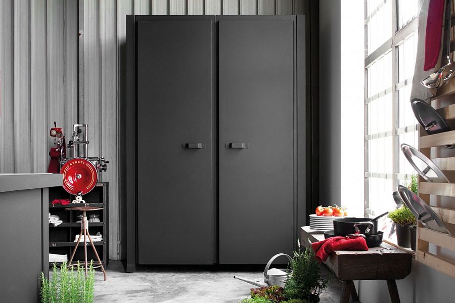 Dark, tall standalone cabinet in the kitchen with custom finish