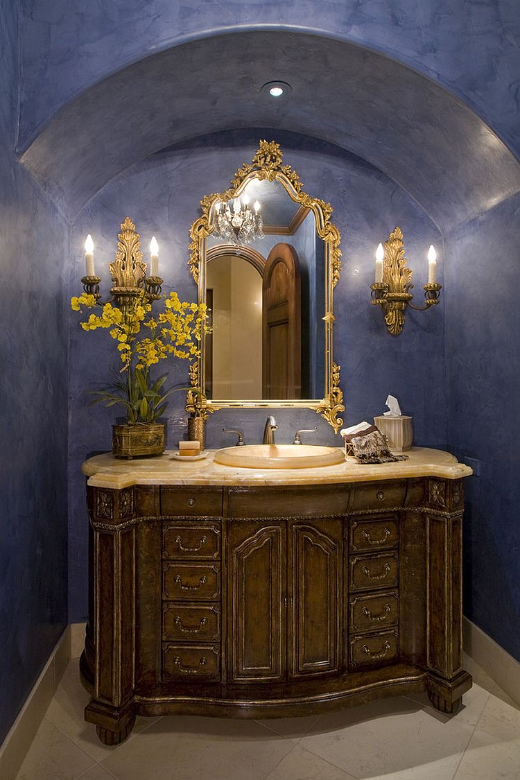 Dashing powder room in bright blue and a dash of gold