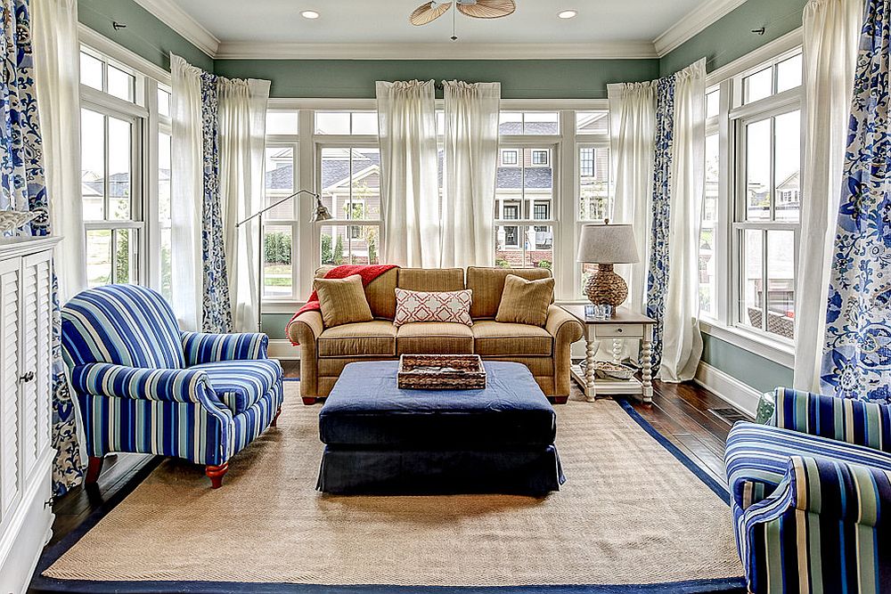 Decor in blue and white is perfect for the beach style sunroom