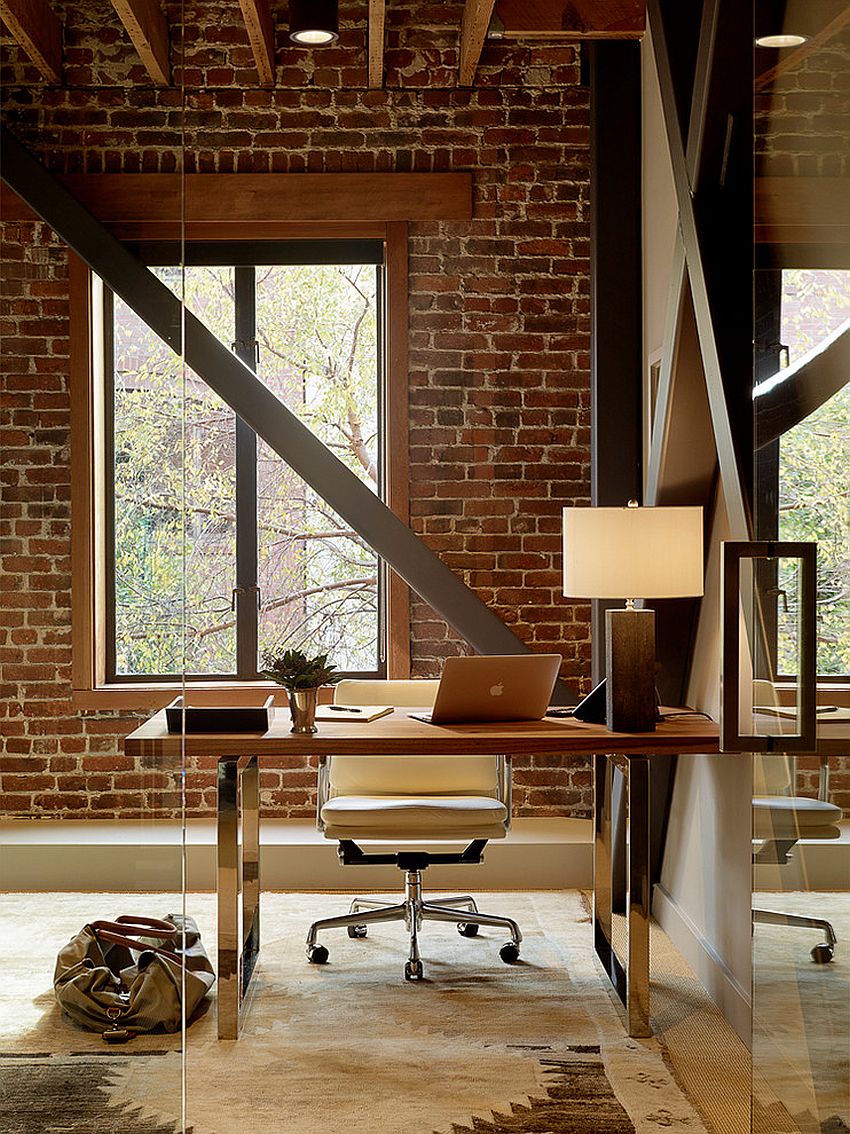 Exposed brick wall backdrop is perfect for the industrial home office [Design: Palmer Weiss Interior Design]