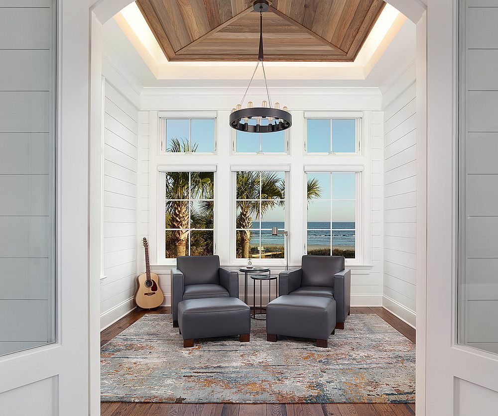 Exquisite beach style sunroom borrows from clean lines of contemporary design [Design: Amy Trowman Design]