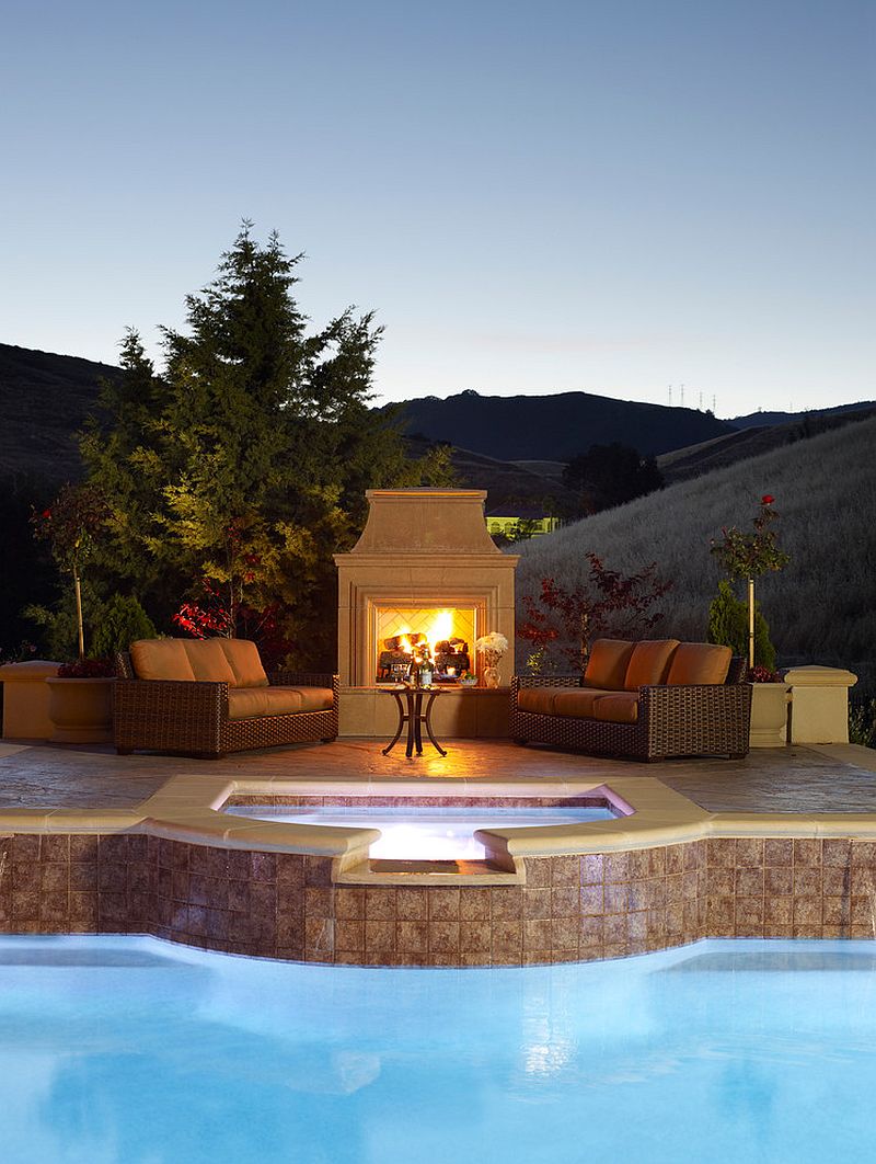 Fireplace and outdoor hangout next to the pool