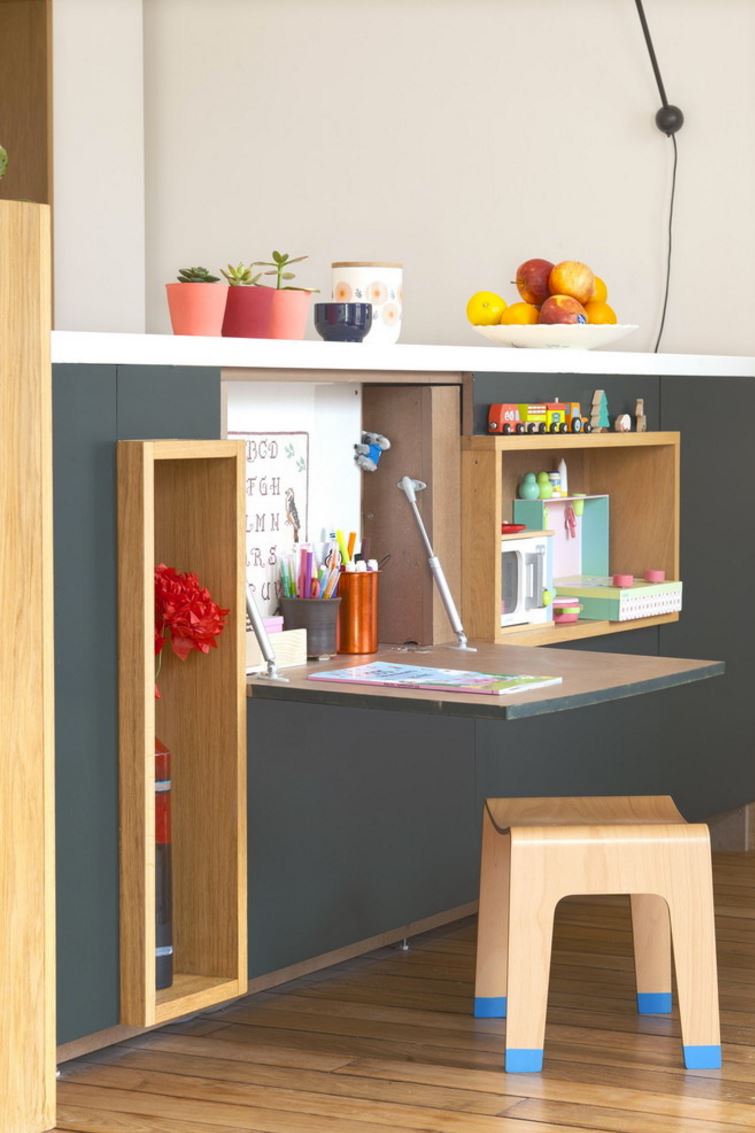 Fold-down desk and art area for a child