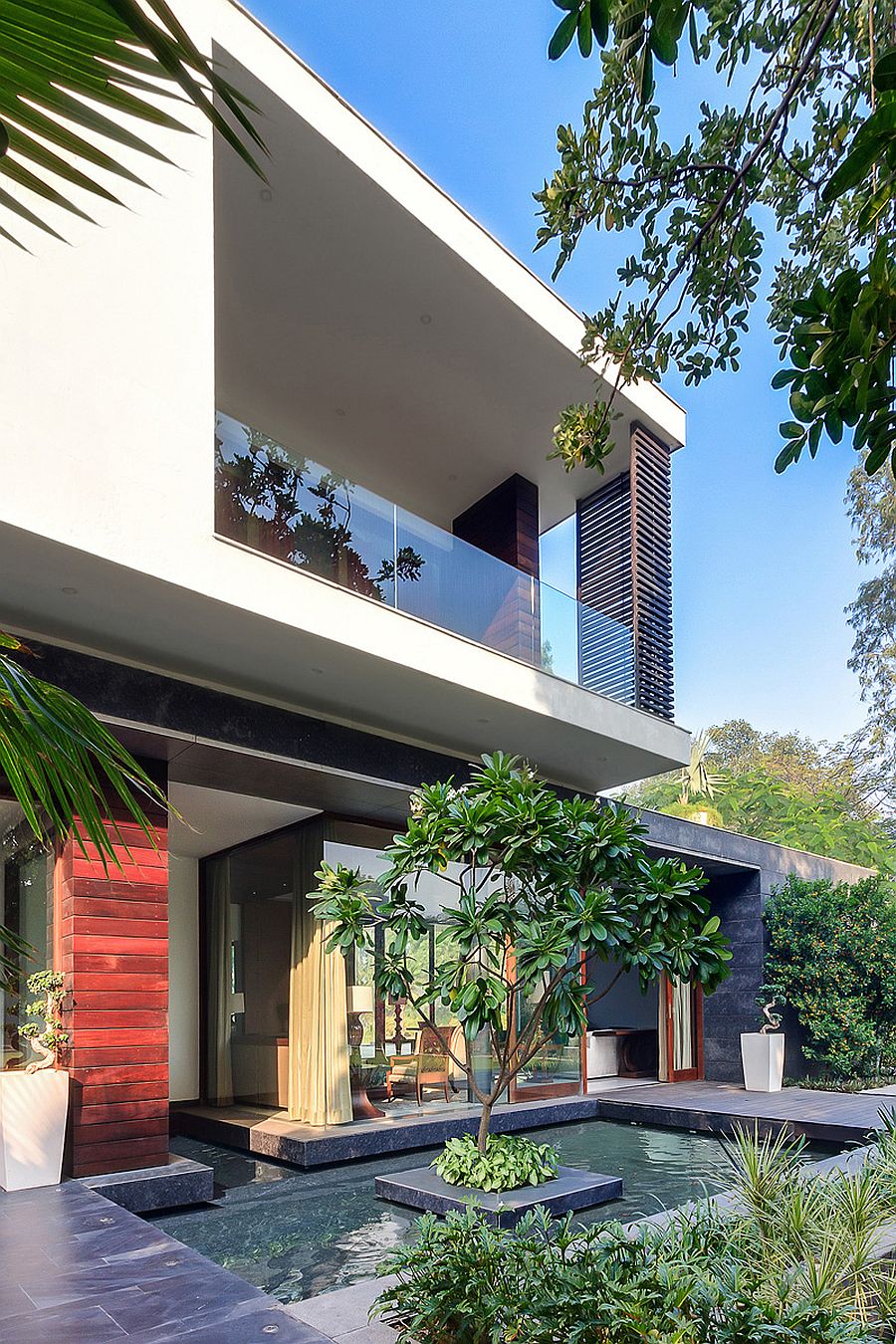 Glass walls and fabulous landscape around the house give it an open, natural look