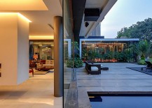 Glass-walls-blur-the-line-between-the-pool-area-and-living-space-217x155