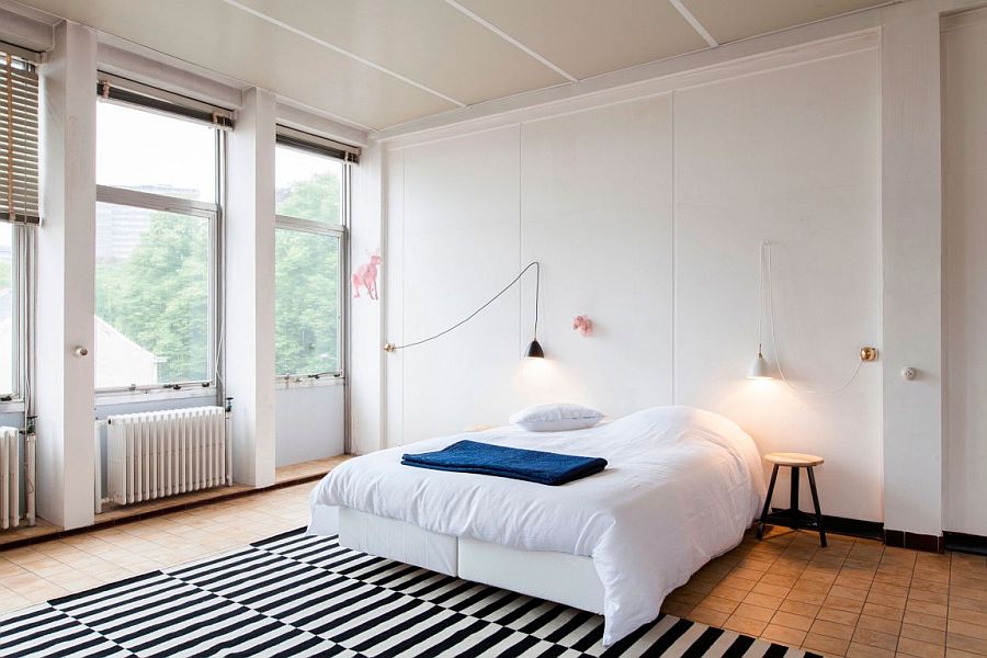Gorgeous bedroom in white showcases a modern Scandinavian design approach