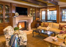 Herringbone-pattern-fireplace-and-exposed-wooden-ceiling-beams-in-the-living-room-217x155