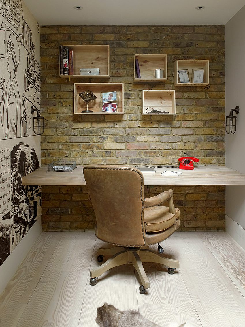 Home office with brick wall, custom wooden shelves and comic strip-styled wall art [Design: Stephen Fletcher Architects]