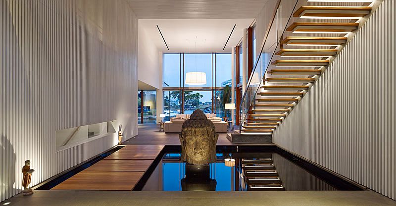 Indoor pond, floating walkway and stairs steal the show inside the home