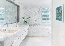 Indulgent-contemporary-bathroom-in-white-with-marble-vanity-and-walls-217x155