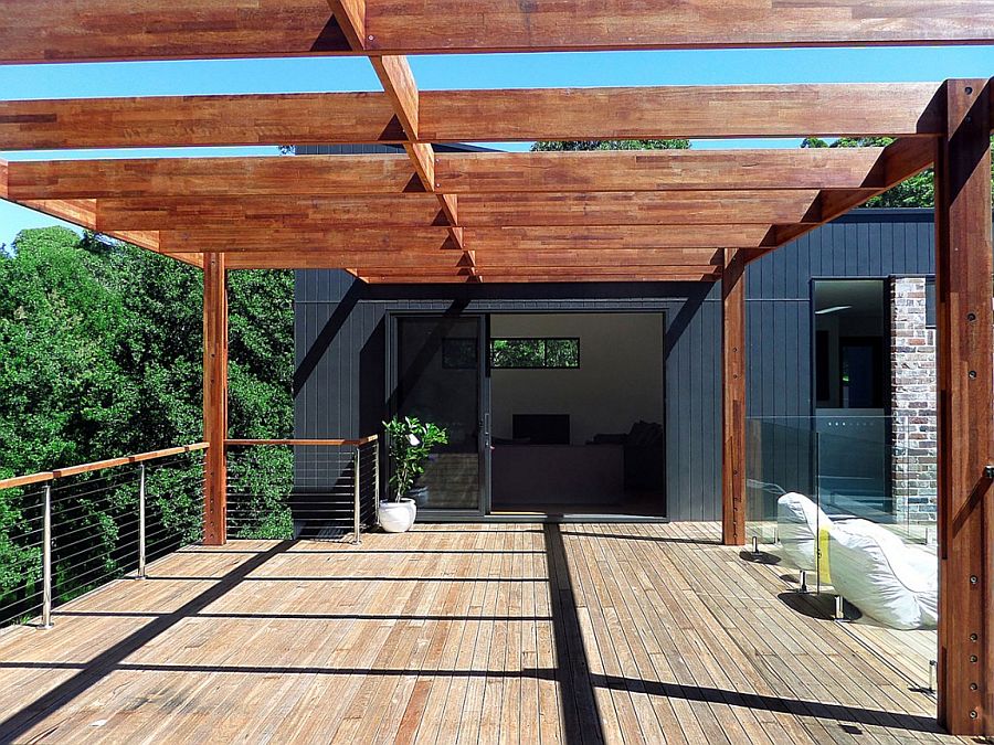 Interior spaces open up into the courtyard and the bush outside