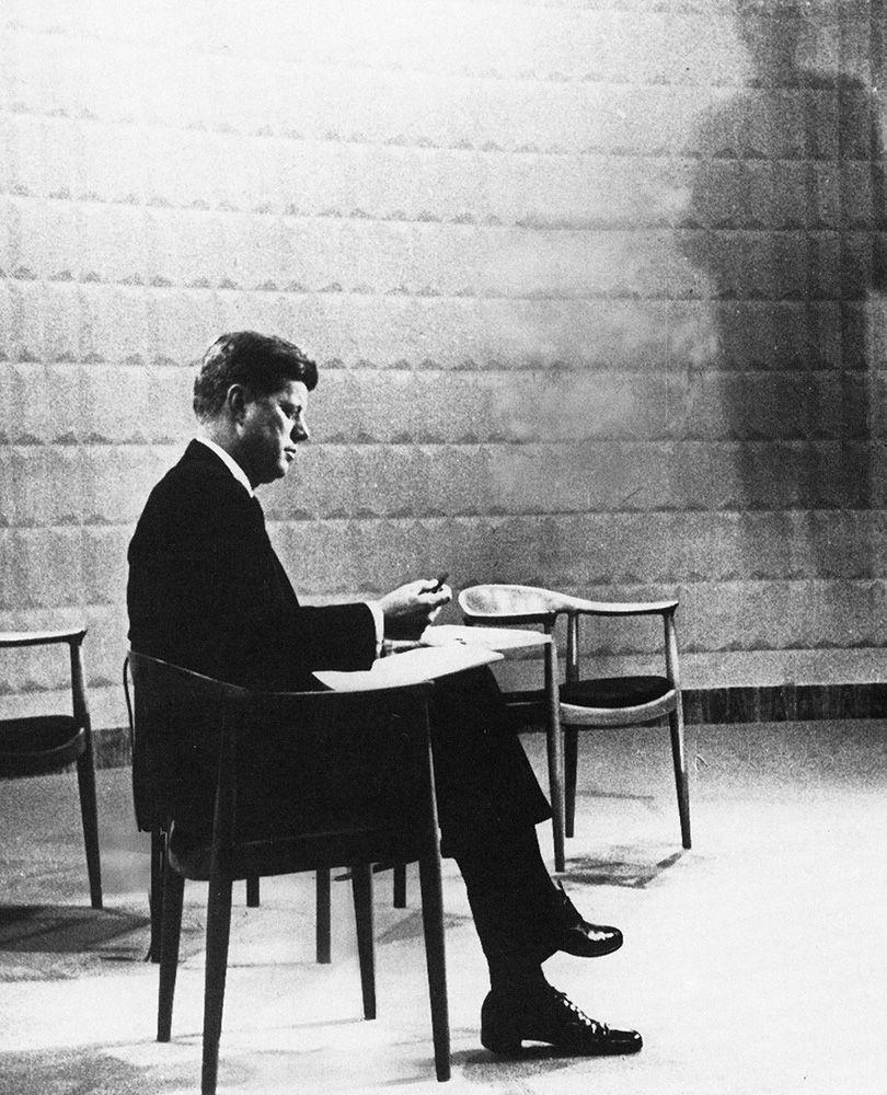 John F Kennedy seated in The Chair