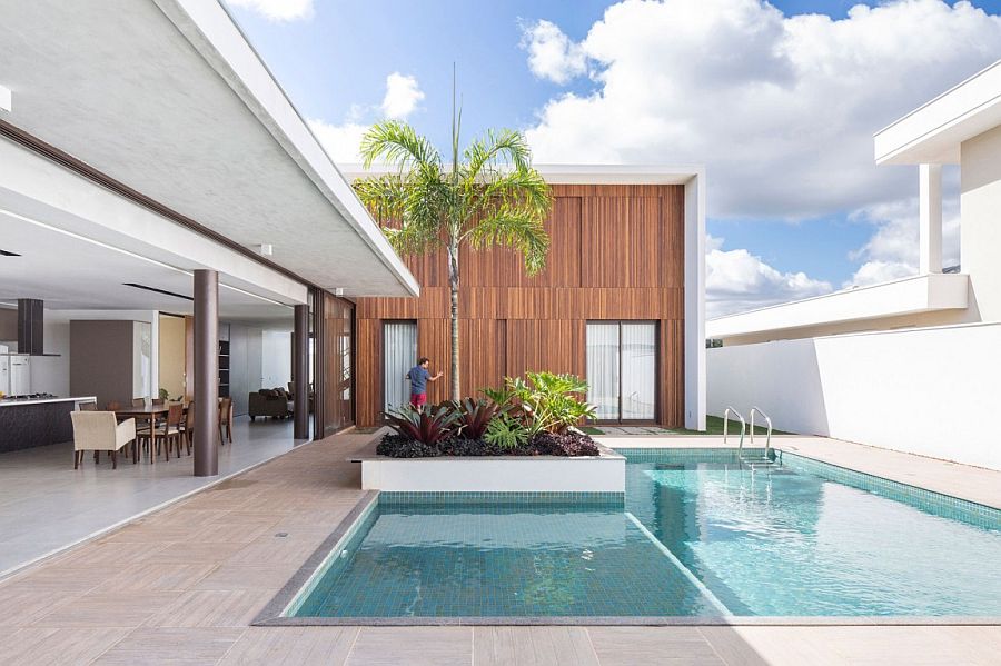 Large moving wooden panels of the structure overlooking the pool area