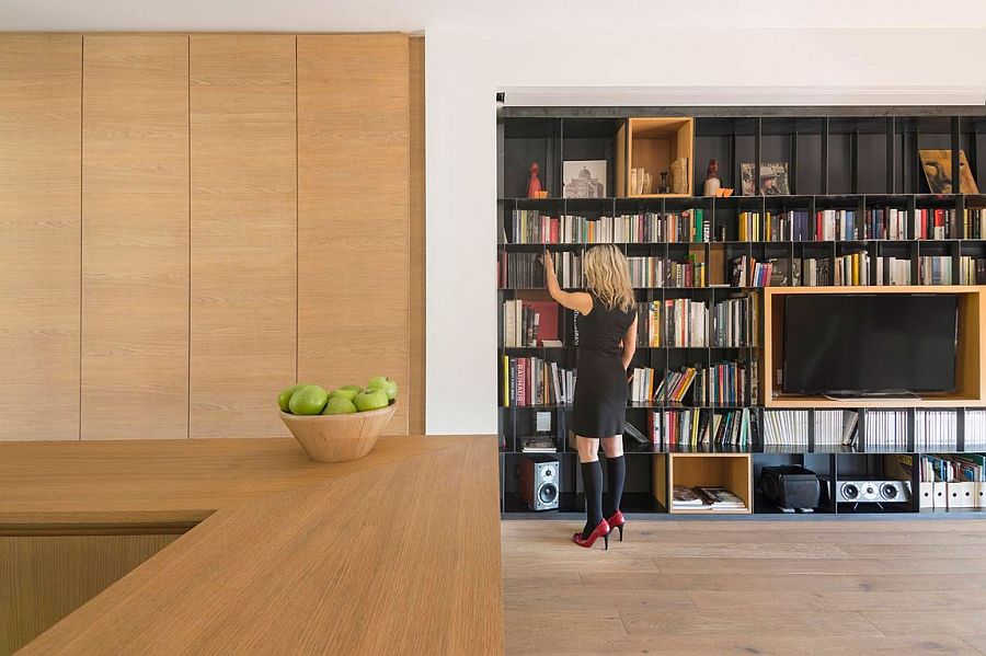 Large wooden shelves and boxes give the interior a curated, minimal appeal