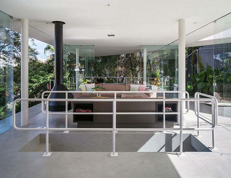 Living area with fireplace and luxurious couch and an open, airy ambiance