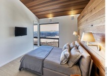 Master-bedroom-with-an-accent-wooden-wall-and-ceiling-217x155