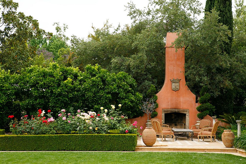 Mediterranean style patio with a striking fireplace that matches its style