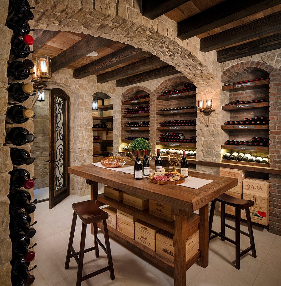 Mediterranean wine storage and tasting room with stone walls