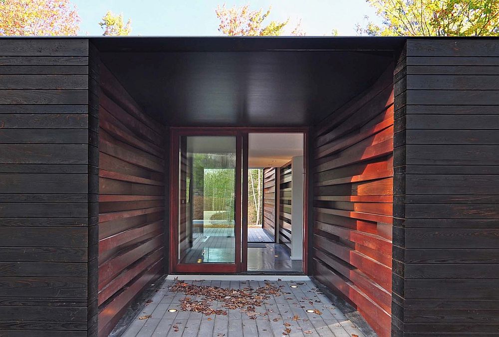Milled lumber with glossy finish stacked at different angles to create an inimitable entry