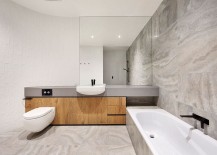 Minimal-bathroom-design-in-white-and-gray-with-curved-wall-217x155