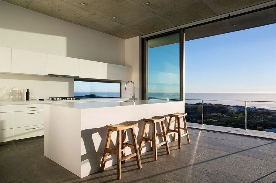 Minimal kitchen of Cape Town home with a stunning view of the distant Indian Ocean