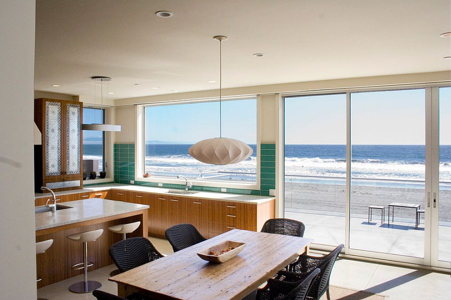 Ocean outside becomes a visual part of the beach style kitchen [Design: Polsky Perlstein Architects]