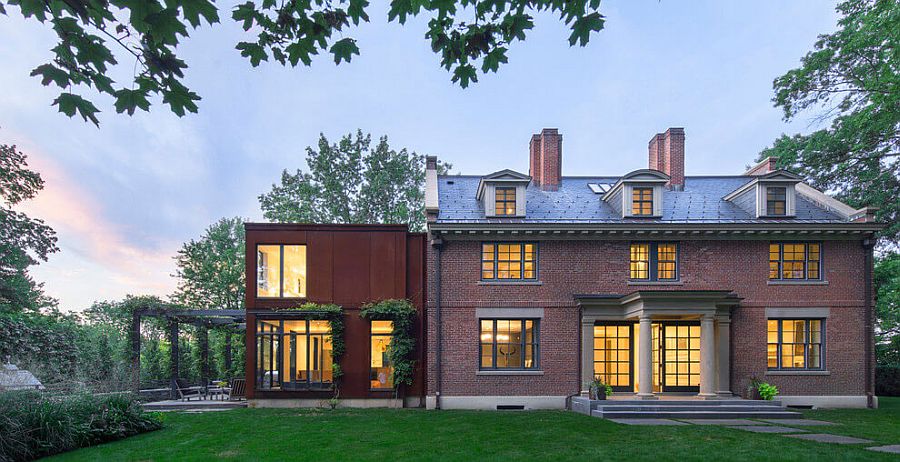 Old Georgian revival brick structure and modern extension in steel combined to create a modern home in Massachusetts