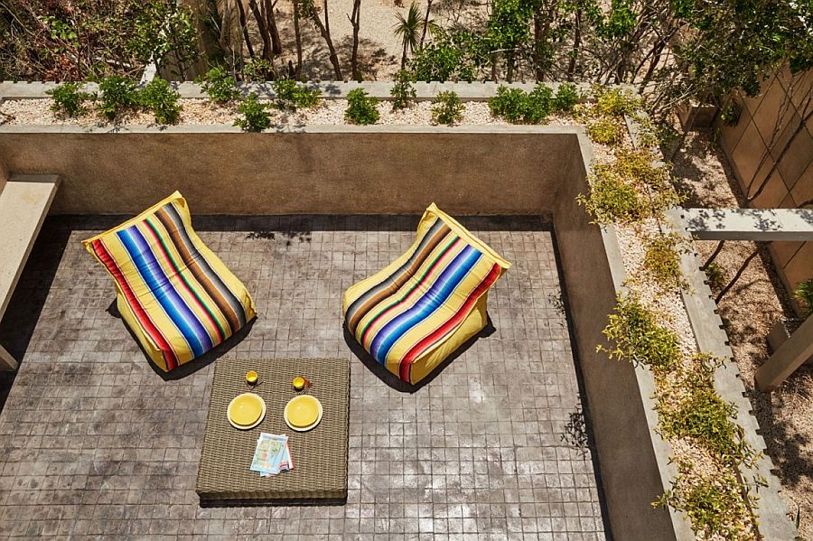 Outdoor decor adds color to the polished cement deck