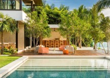Outdoor-lounge-and-BBQ-area-surrounded-by-palm-trees-217x155