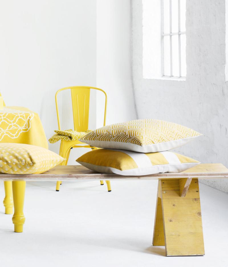 Pairing yellow with crisp white and warm wooden tones