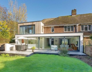 Classic English Home with Brick Façade Acquires a Nifty Modern Extension