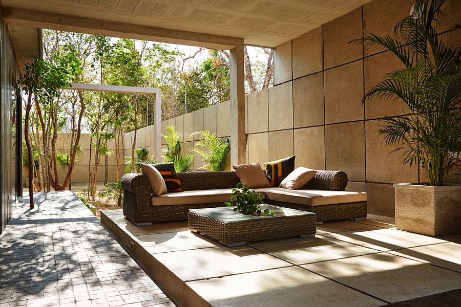 Shaded outdoor patios and greenery create a cool home staycation zone