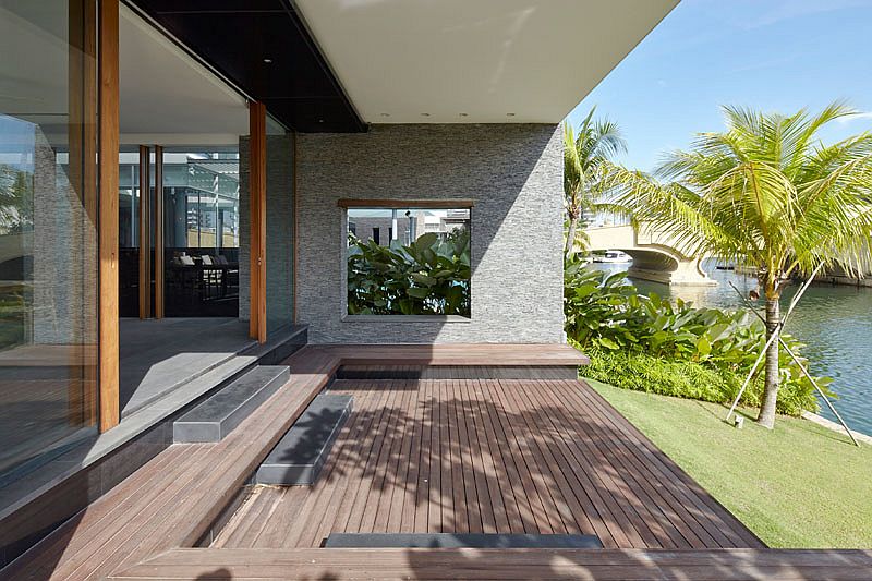 Simple deck and landscape allows the homeowners to enjoy canal views