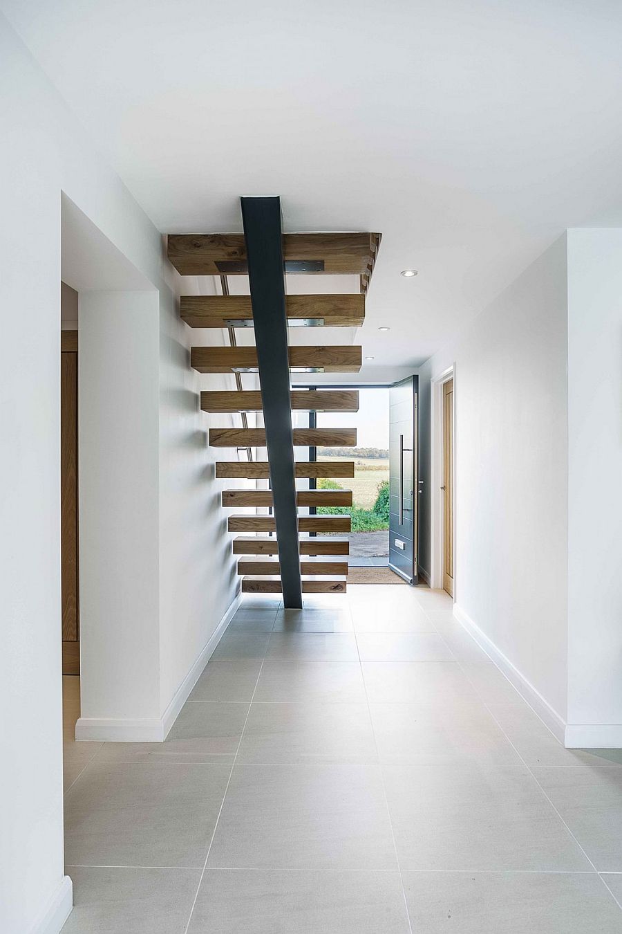 Sleek and stylish staircase leading to the master bedroom on the first level